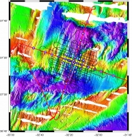 Figure 1: Map view of the Lucky Strike segment and the SISMOMAR
experiment.  Map colors are bathymetry (blue=deep, red=shallow),
circles are OBS positions, lines are refraction seismic shot points
(black = 3D refraction, red = 2D refraction).  The yellow box
indicates the 3D seismic reflection experiment bounds (see Figure 2).